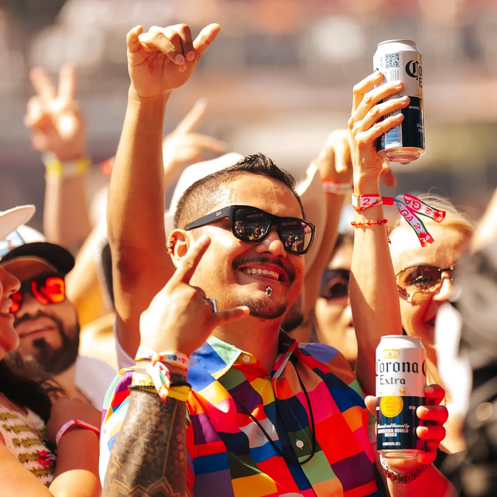 man in crowd at la onda with corona